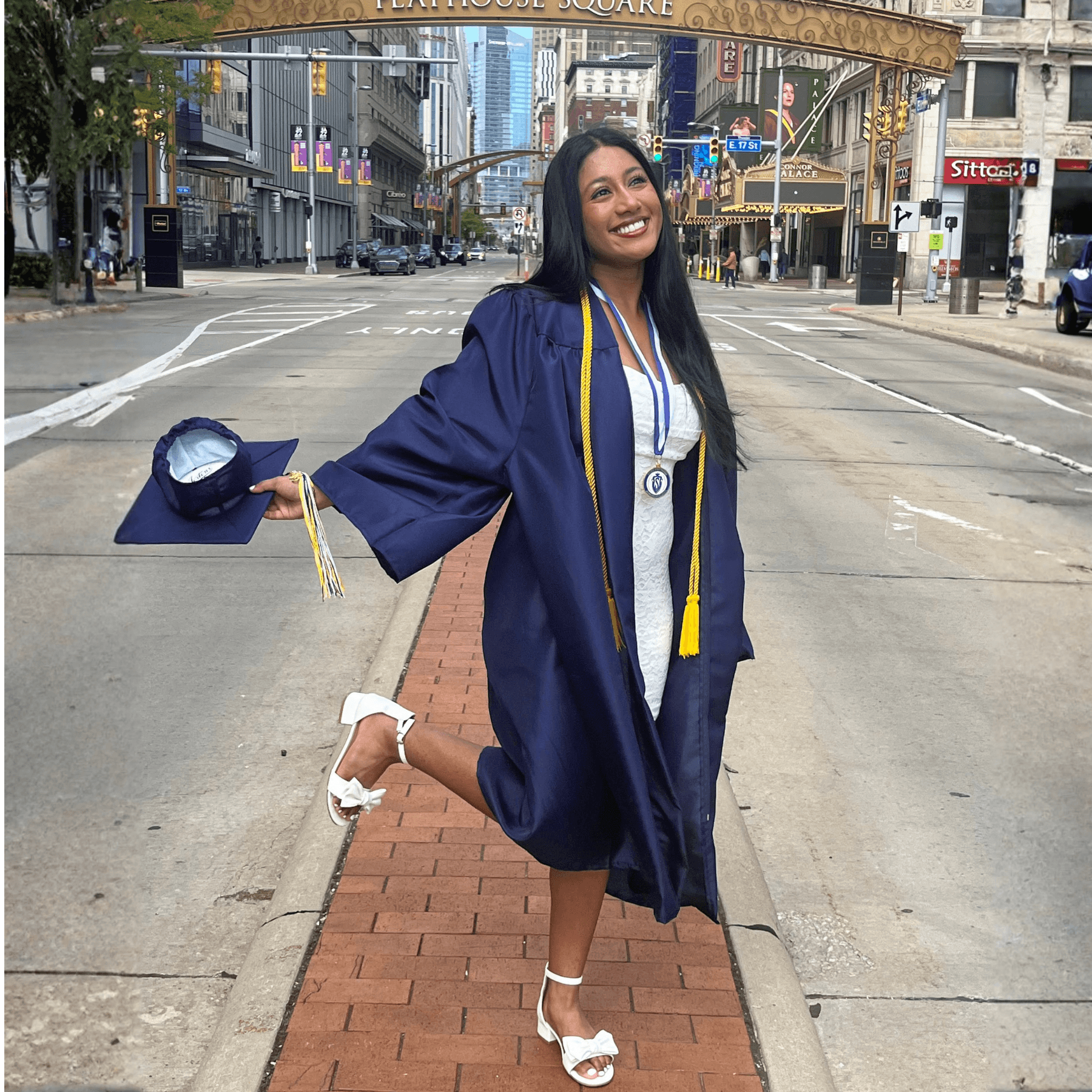 Maya smiling in graduation gown